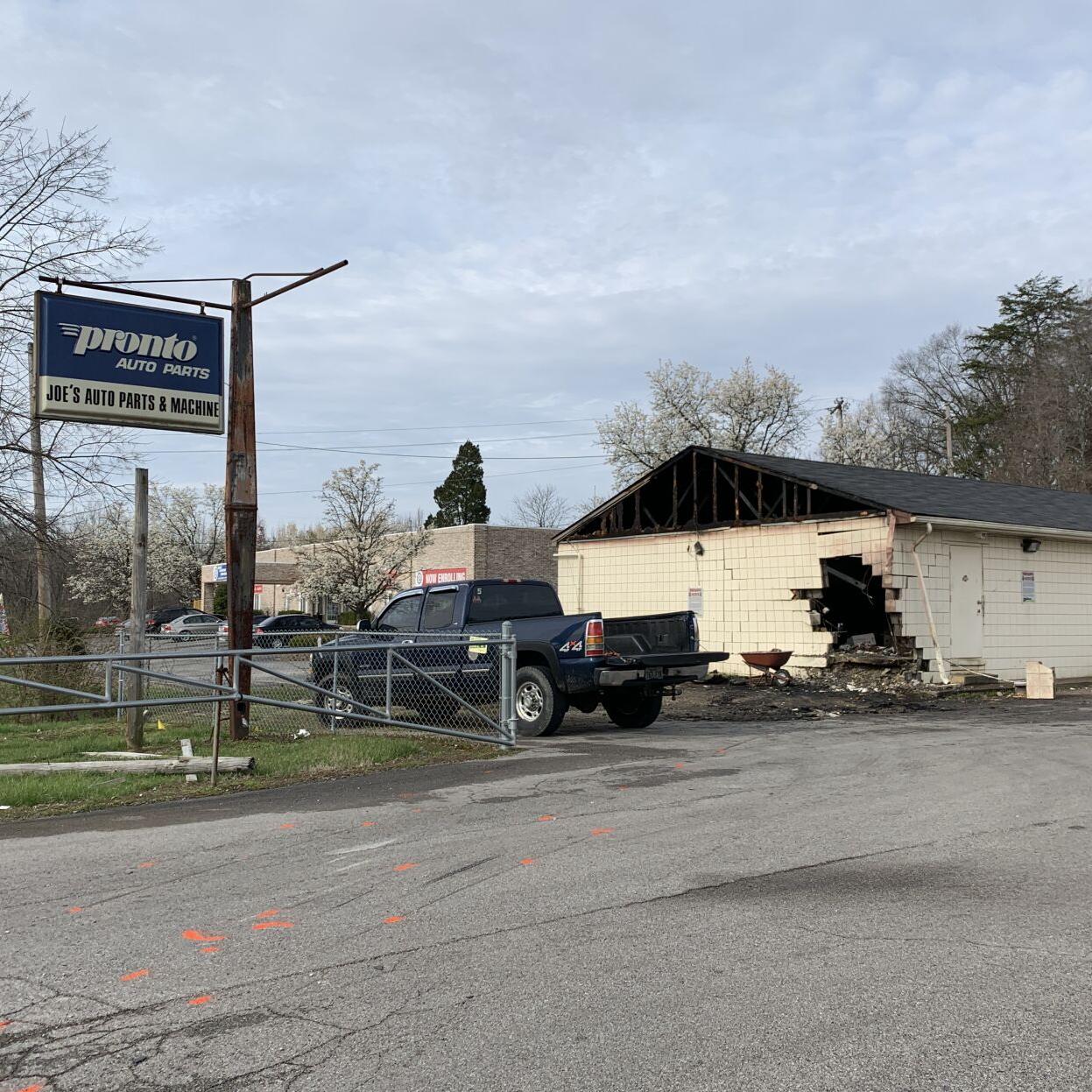 Burning car toasts building after crash.jpg